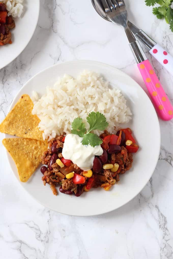 chilli con carne with rice and tortilla chips