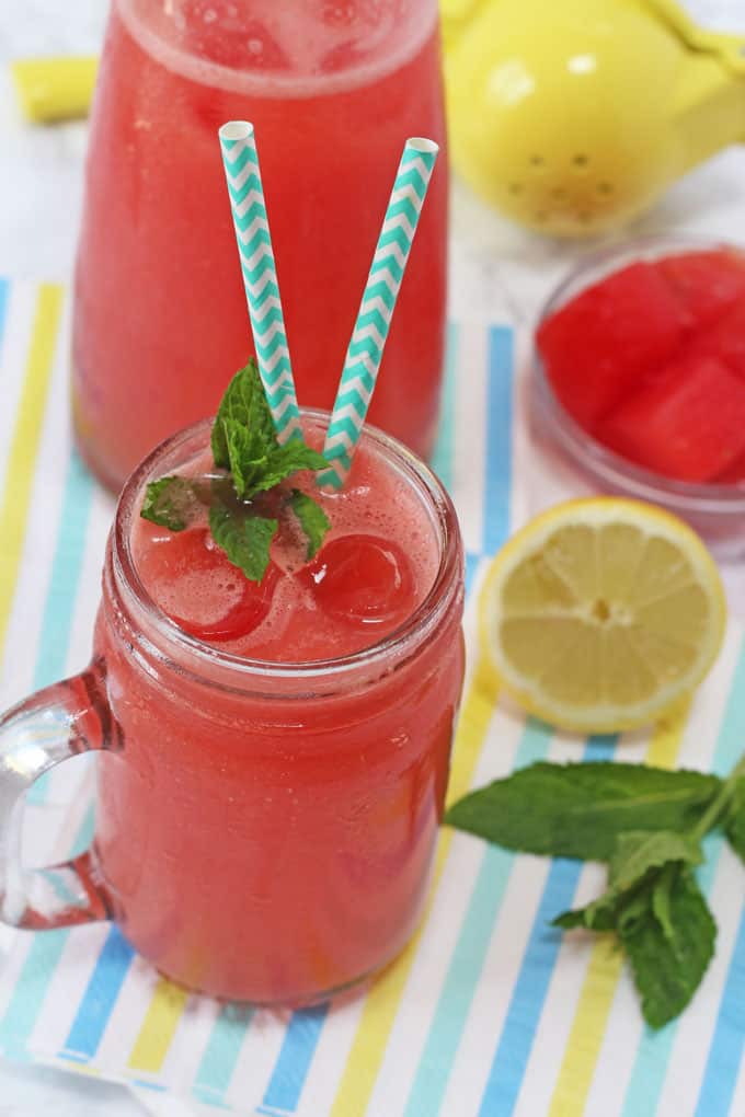 Watermelon Lemonade in the glass jar with ice cubes shown from above