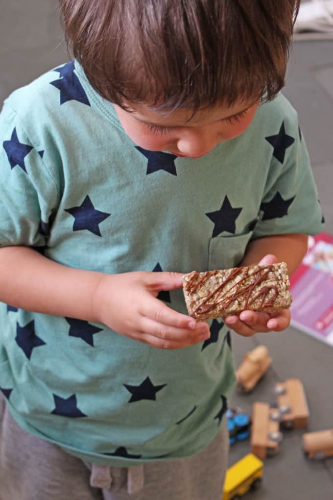 child holding energy bars