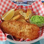 Chip Shop style fish and chips made easy with Young's Chip Shop Cod Fillets, homemade chips, minted mushy peas and curry sauce!