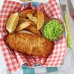 Chip Shop style fish and chips made easy with Young's Chip Shop Cod Fillets, homemade chips, minted mushy peas and curry sauce!