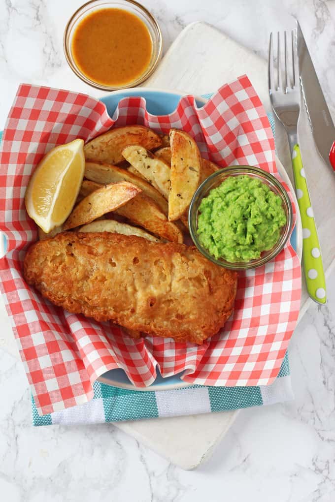 Chip Shop style fish and chips made easy with Young's Chip Shop Cod Fillets, homemade chips, minted mushy peas and curry sauce!
