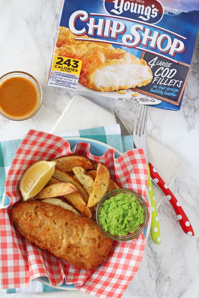 Chip Shop style fish and chips made easy with Young's Chip Shop Cod Fillets, homemade chips, minted mushy peas and curry sauce!