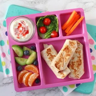 These Ham & Cheese Wraps and folded up like mini burritos and dry fried quickly to make them melting on the inside but crispy on the outside. So delicious and perfect for lunch at home or a packed lunch at school!