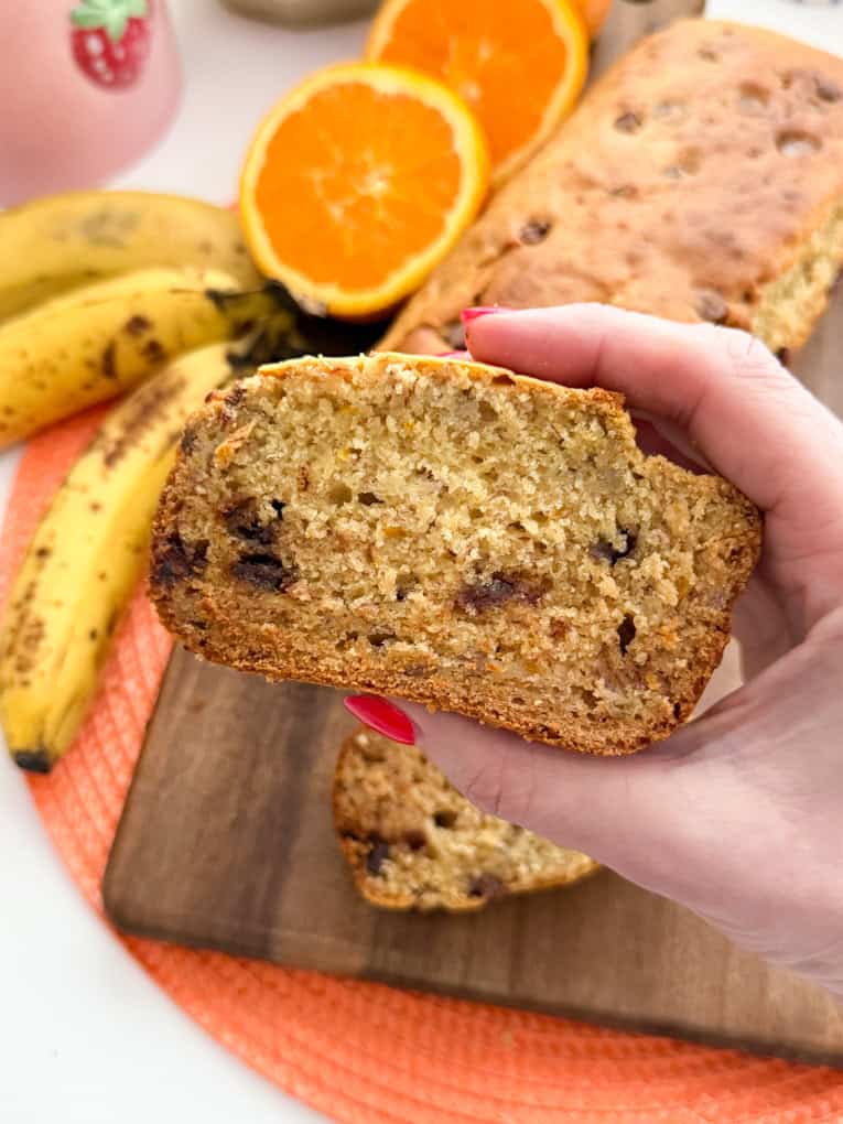 A slice of the healthy banana bread to show the chocolate chips in the middle.