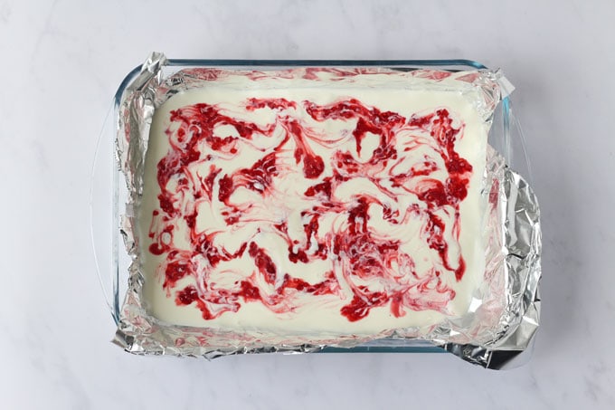 Yogurt in a dish with raspberry puree