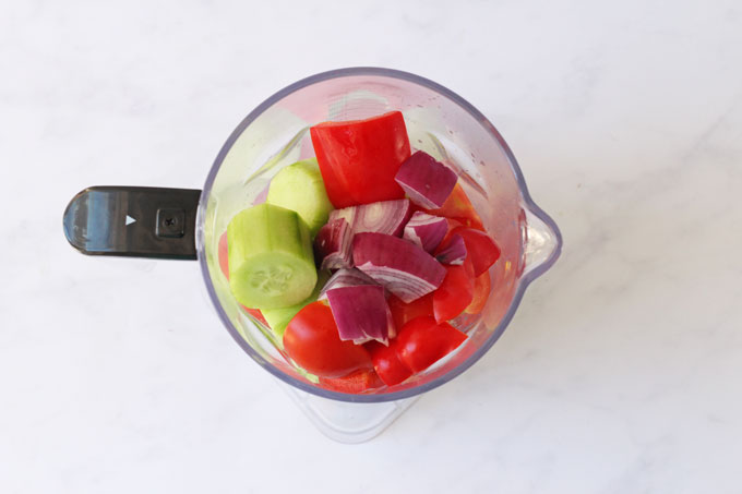 Ingredients for gazpacho soup in a blender