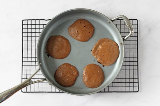 Chocolate pancakes in a frying pan