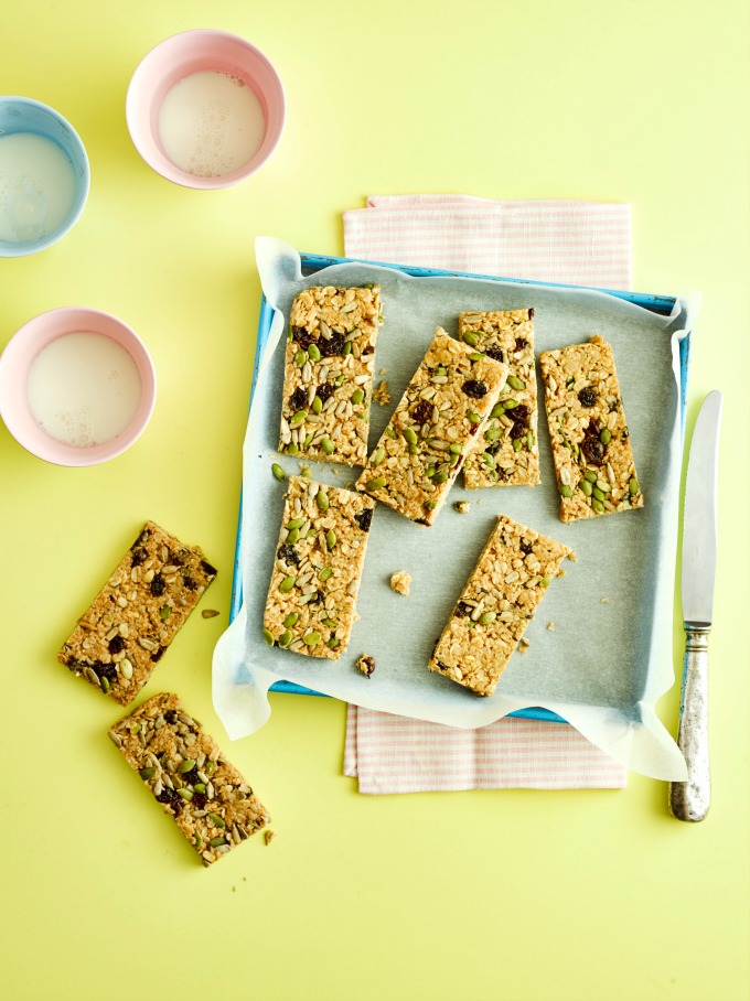 No Bake Peanut Butter Flapjacks on a blue tray and yellow background