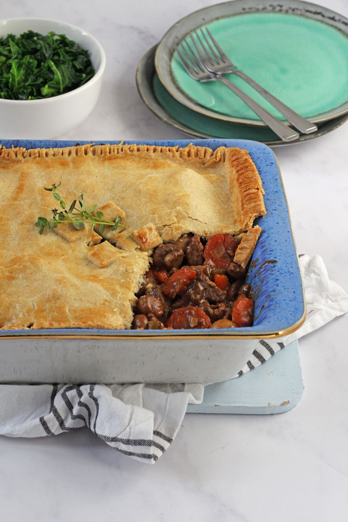 Beef & Vegetable Pie in a large blue pie dish