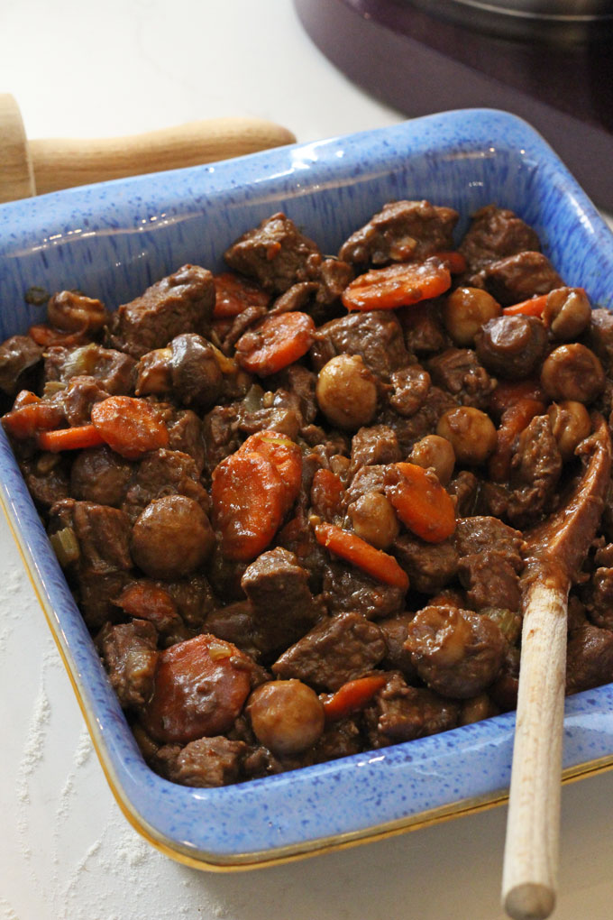 The Beef & Vegetable Pie mixture cooked and in the oven dish