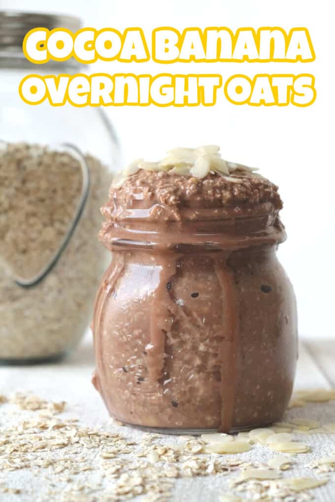 Cocoa Banana Overnight Oats in a small glass jar with a pot of rolled oats in the background.