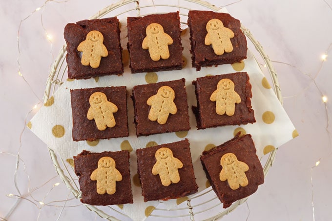 Gingerbread Brownies on a cooling rack topped with mini gingerbread men