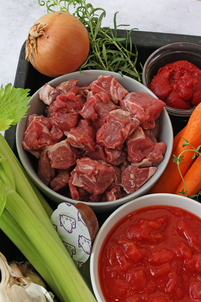 a close up of the chopped lamb chunks for the ragu recipe