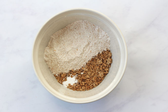 crushed weetabix in a bowl with flour & baking powder