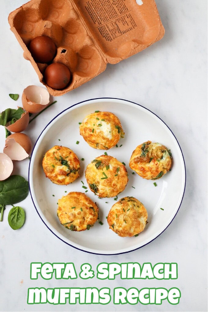 Six Feta & Spinach Muffins in a blue and white enamel bowl garnished with freshly chopped chives.