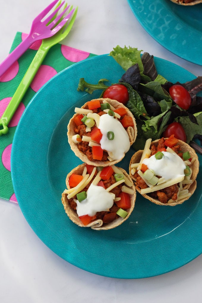 Quorn Taco Cups. Delicious baked tortilla cups filled with mexican quorn and topped with sour cream, cheese and peppers