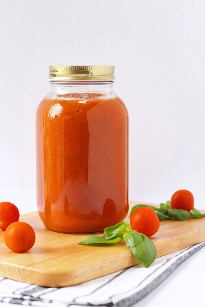 A clear jar containing Hidden Veggie Tomato Sauce.