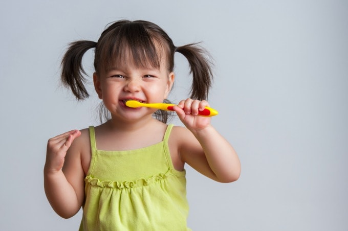 child brushing their teeth