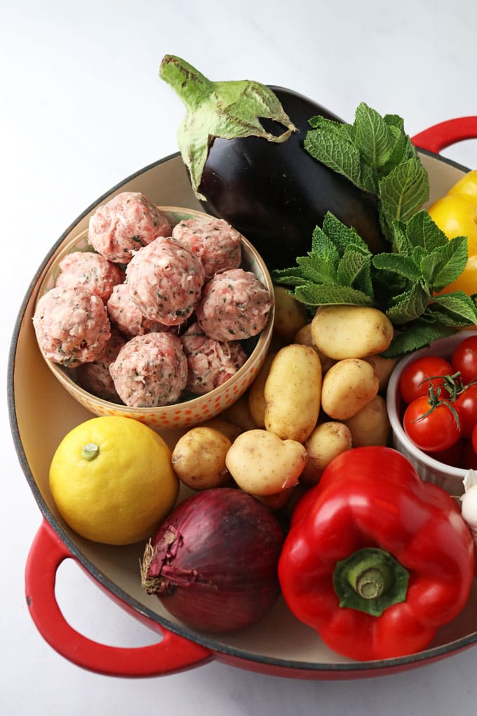 Ingredients in a dish for One Pot Greek Lamb Meatballs