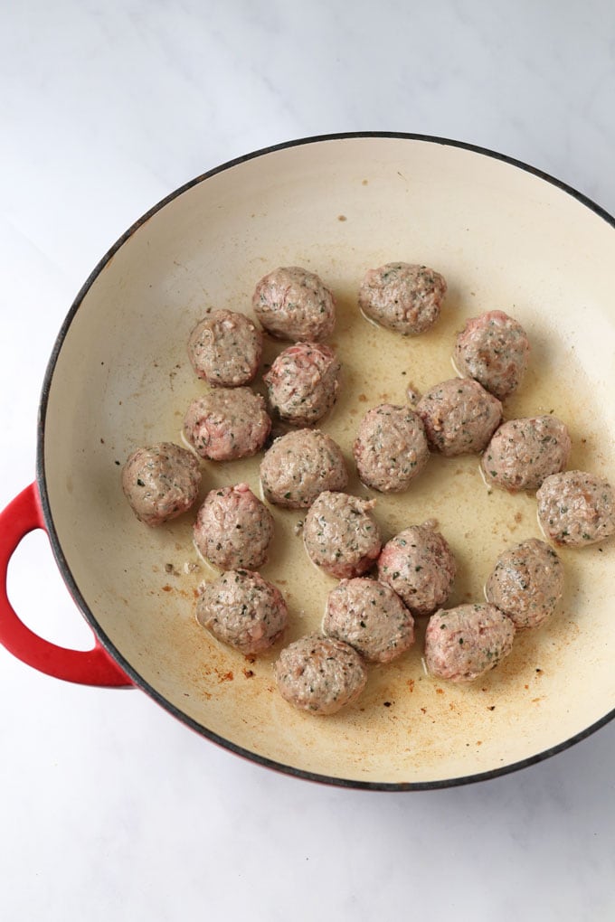 Lamb Meatballs frying in a pan