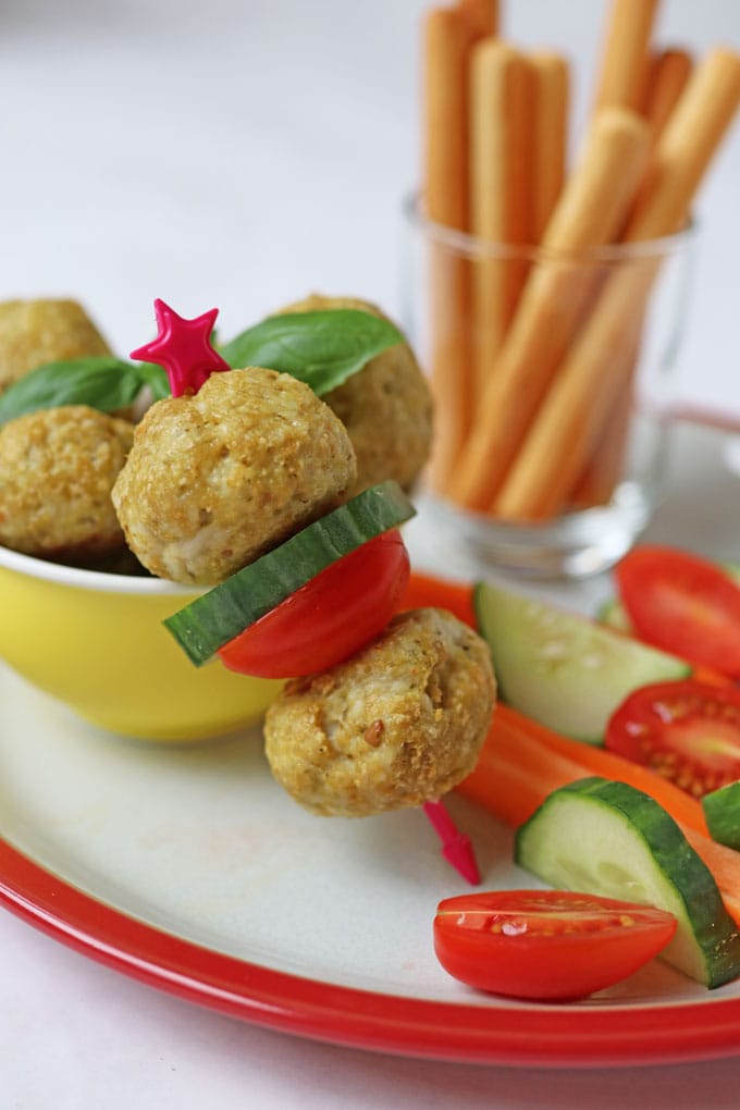 Chicken Meatballs on a skewer with tomato and cucumber