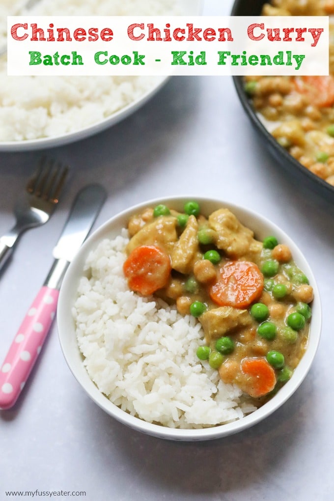 Chinese chicken curry served in a white bowl alongside white fluffy rice.