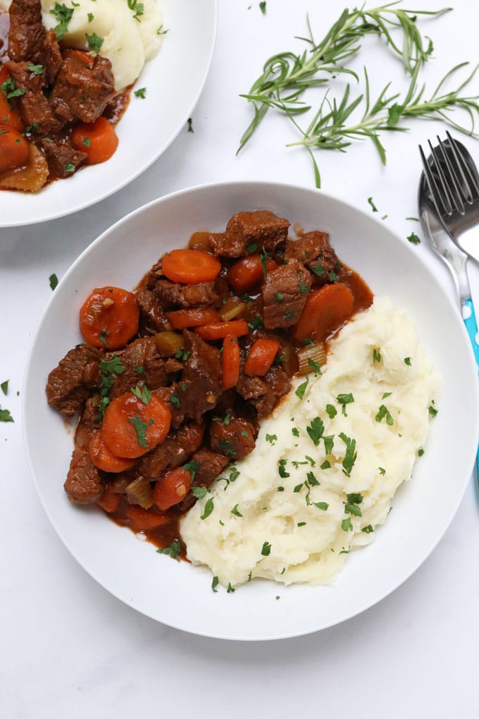 slow cooker beef casserole served with mashed potato