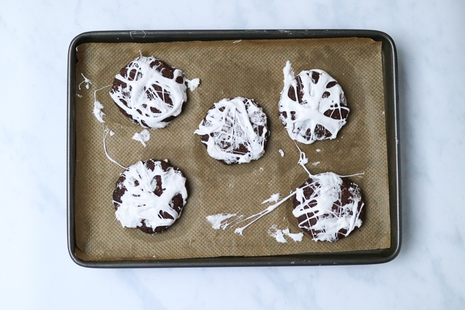 cookies with marshmallow topping on a baking tray
