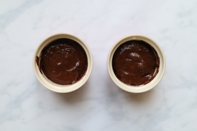 the remaining mixture now in the ramekins to cover the chopped creme egg.