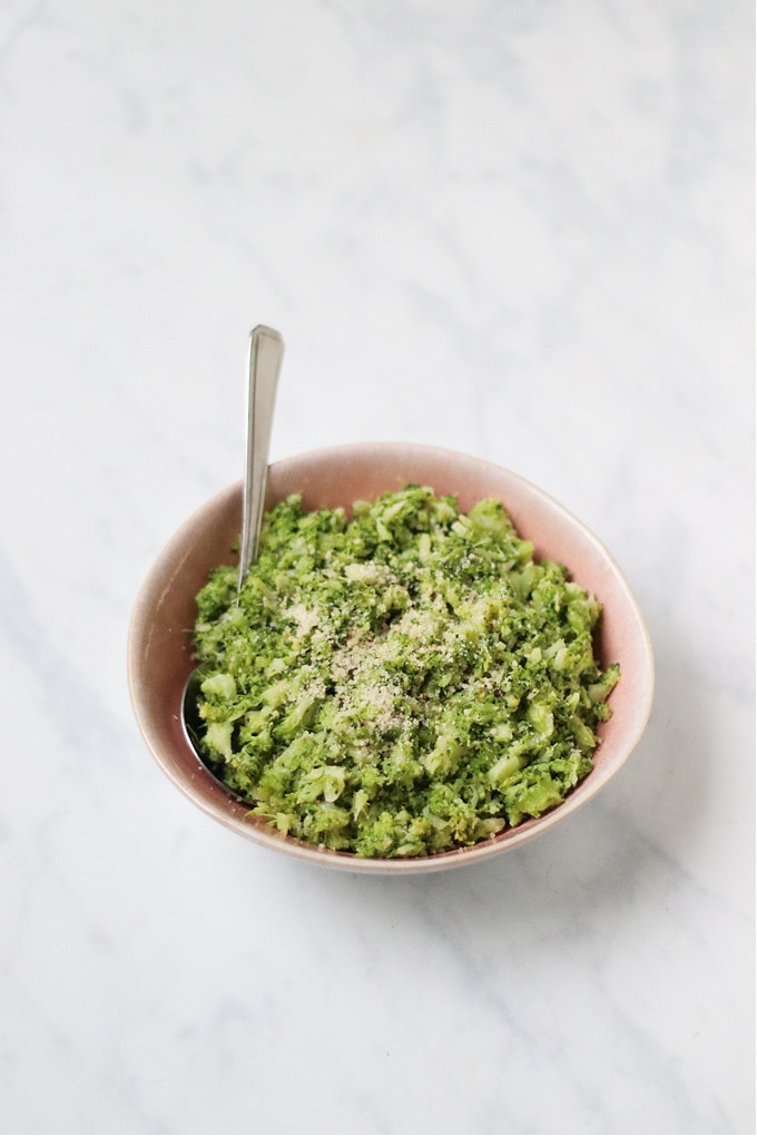 Garlic & Parmesan Broccoli Mash served in a pink bowl ready to eat.