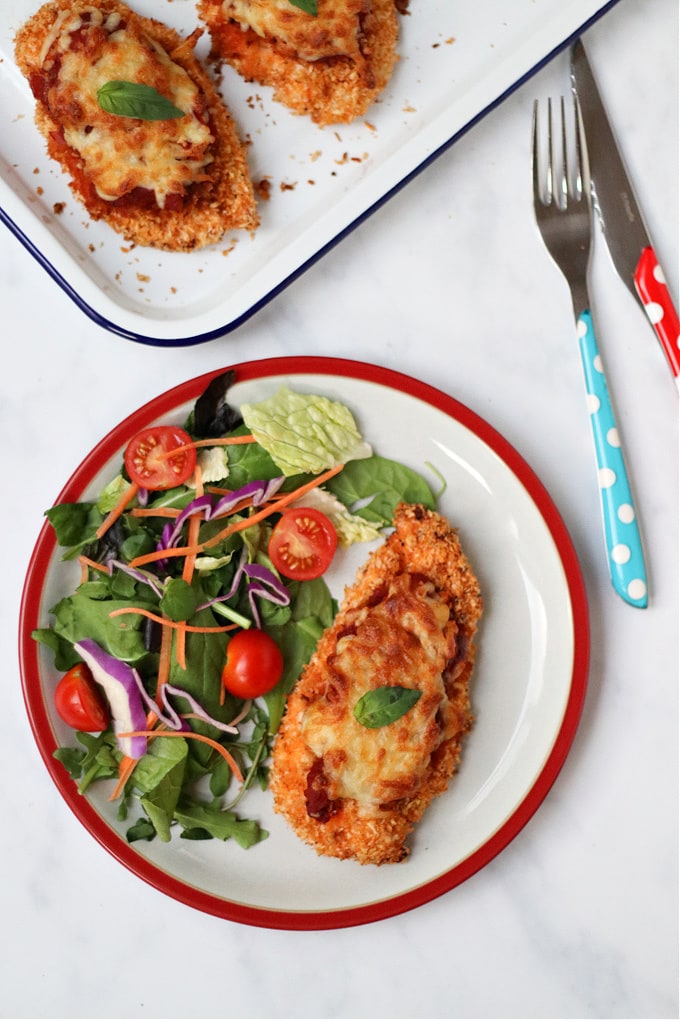 Crispy Chicken Parmesan served with a side salad