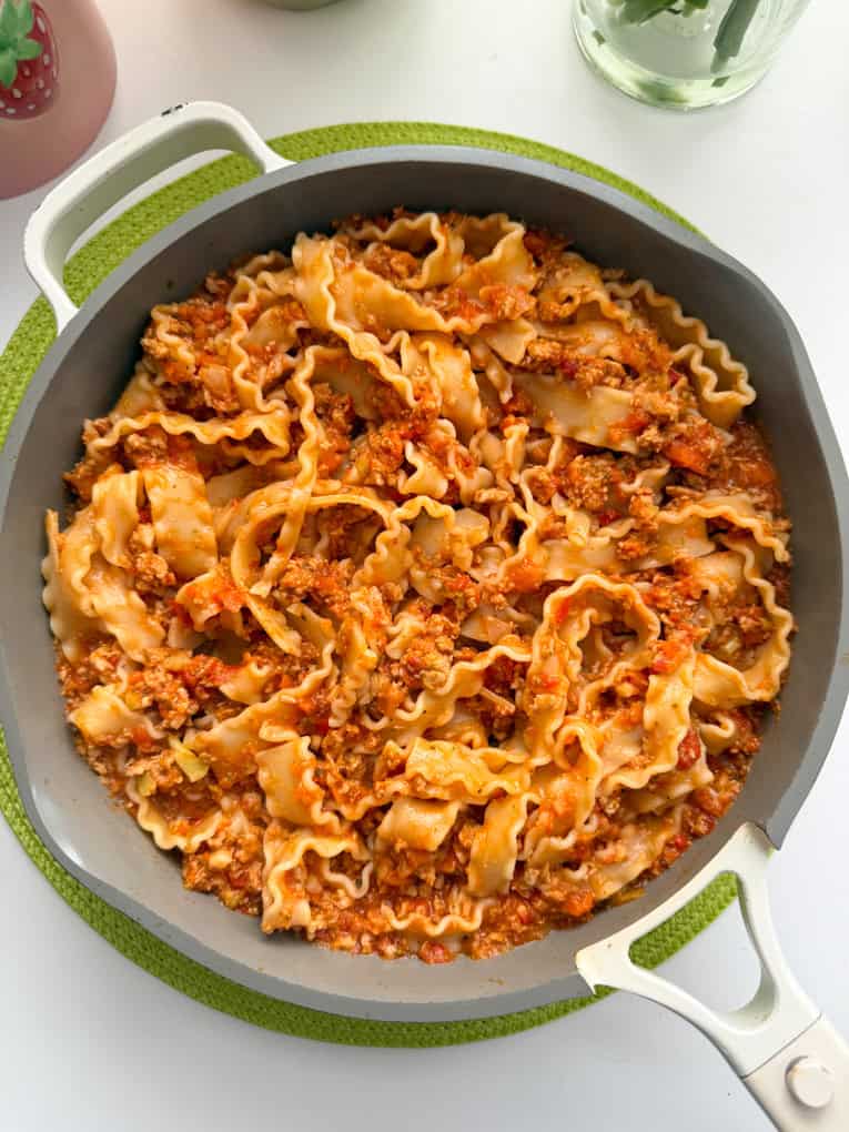 A saucepan filled with turkey sausage ragu, 