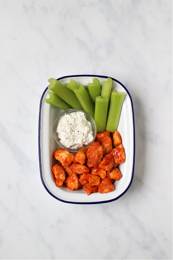 Buffalo Chicken Bites served with celery and blue cheese dip