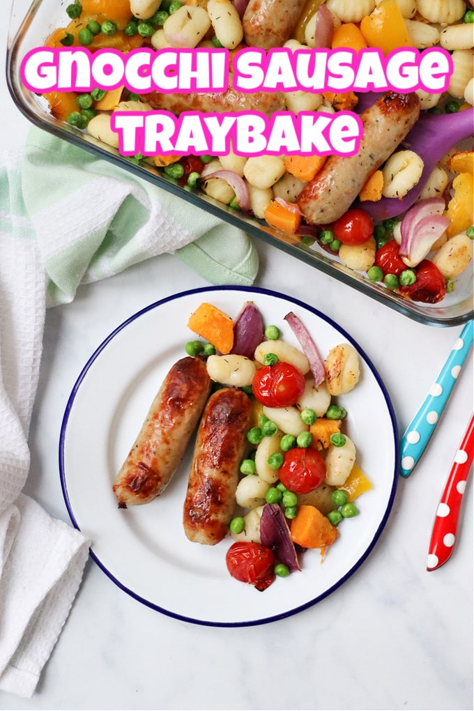 Gnocchi sausage traybake served on a white dinner plate with a dark blue rim.