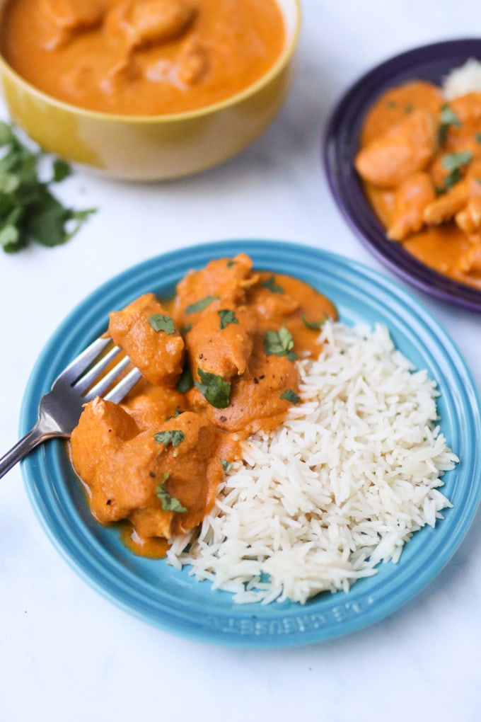 hidden veg chicken curry served with rice on a blue plate