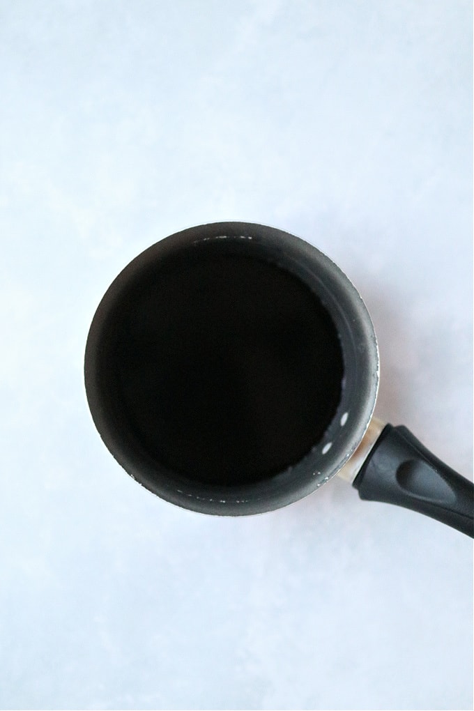 a saucepan containing the ingredients for the balsamic glaze