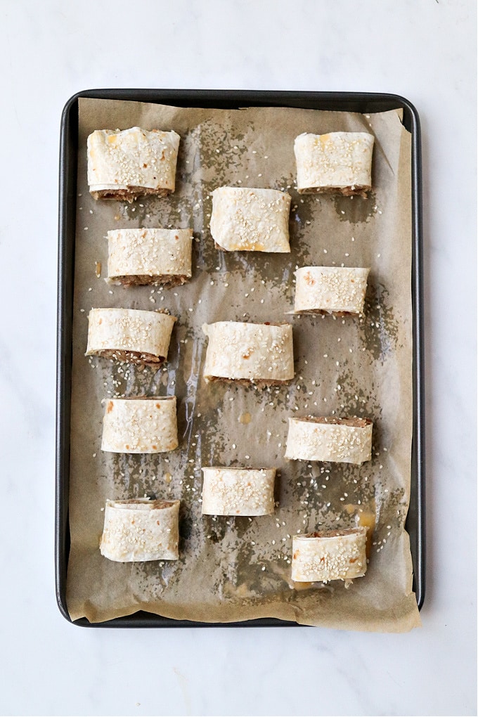 sausage rolls on a baking tray