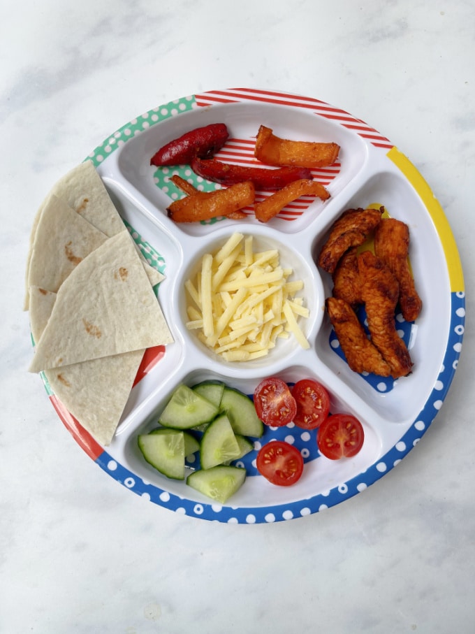 deconstructed turkey wrap for kids served on a pick plate