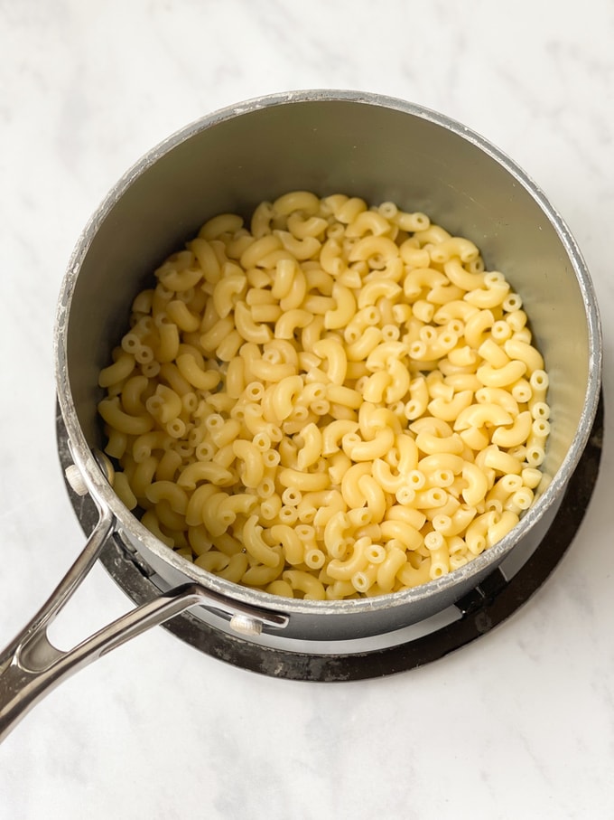 cooked macaroni in a saucepan on a trivet