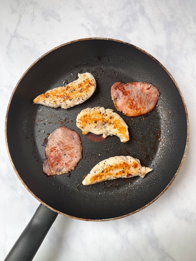 bacon and chicken mini fillets in a frying pan