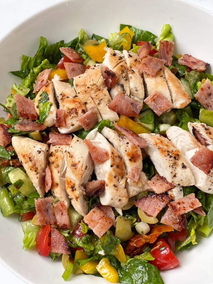 chicken & bacon salad served in a white bowl