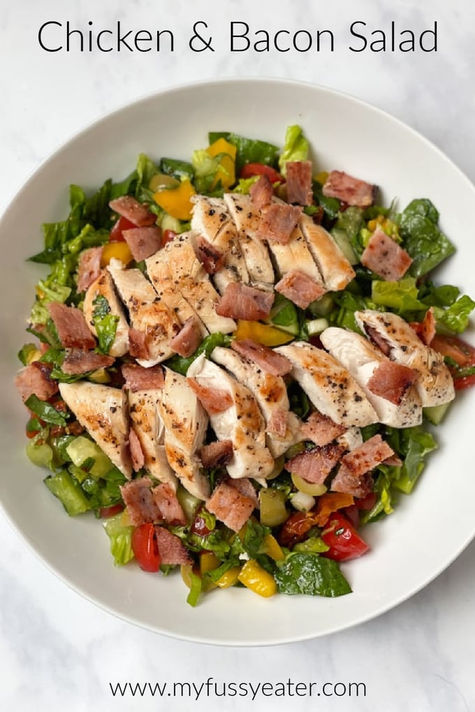 chopped chicken and bacon salad in a white bowl