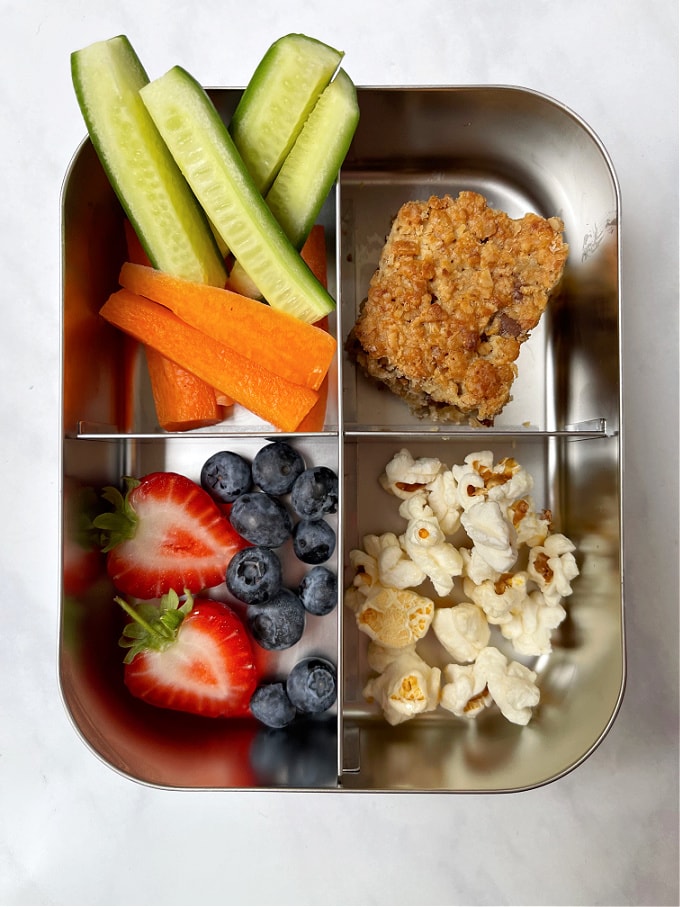 Nut Free Granola Bar in a lunch box with fruit and vegetables