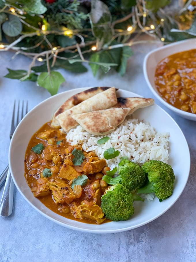 Boxing Day Food - Leftover Turkey Curry served with white rice, naan bread and a side of cooked broccoli