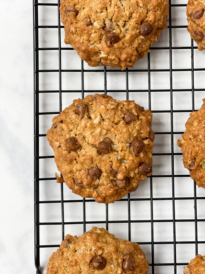 Close up of the Chunky Chocolate Chip Oat Cookies cooling on a wire rack.