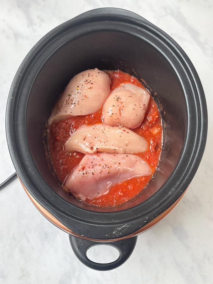 all raw ingredients in a slow cooker
