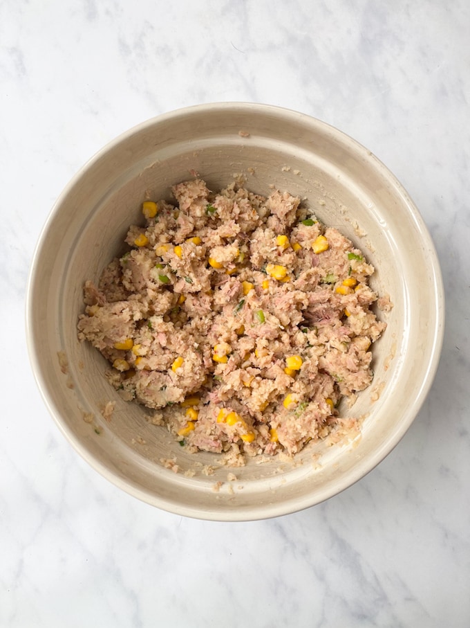 the tuna sweetcorn bite ingredients mixed together in a mixing bowl