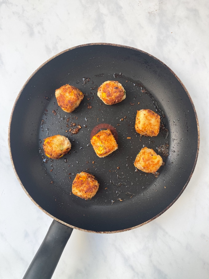 the cooked bites in a frying pan