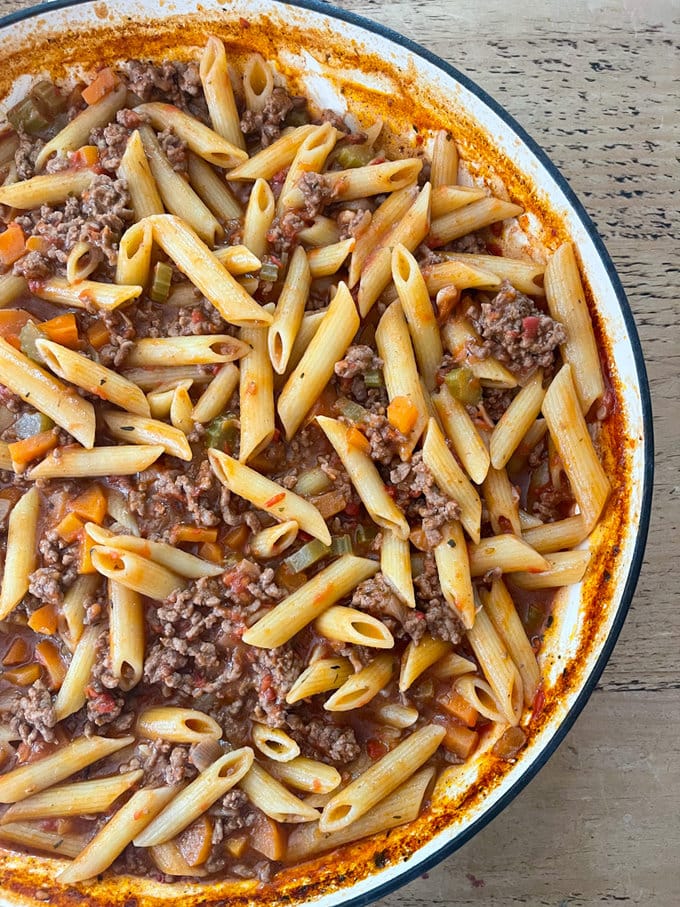 the cooked bolognese in a large white pan